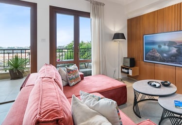 Sofa seating area with large TV and entertainment options at Theseus Retreat holiday rental in Cyprus