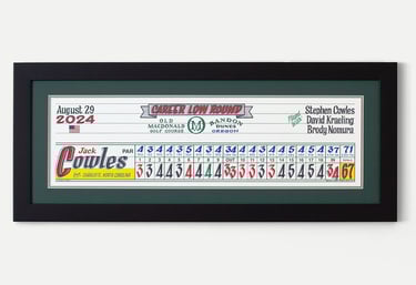 A framed piece of scorecard artwork for Jack Cowles who shot his career low round at Bandon Dunes.