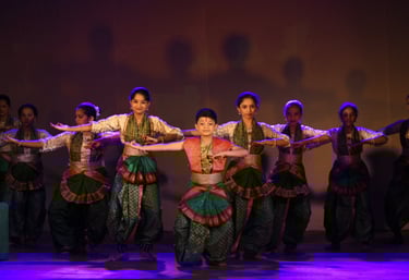 The batch of bharatanatyam performing on stage by Kalpangan Sanskrutik Kendra