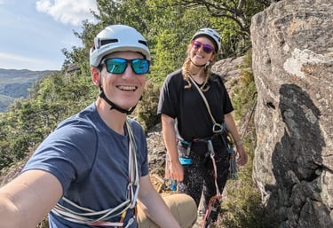 couple rock climbing