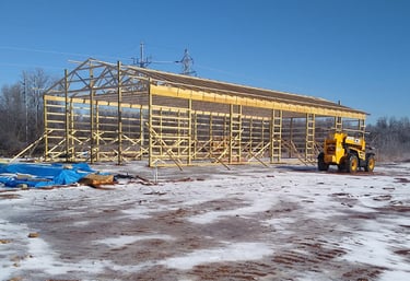 a construction site with a construction crane and a construction worker