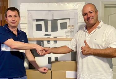 the CEOs shaking hands over boxes of LIFE2.0