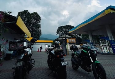 three bikes standing at fuel station