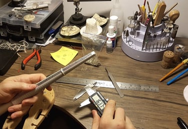 a person holding a ruler and measuring ruler