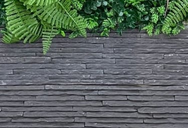 a man in a suit and tie standing on a wooden deck