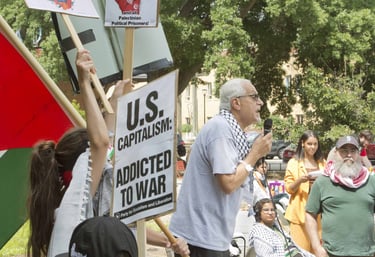 Burhan Ghanayem speaks passionately to a crowd at a protest