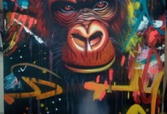 a painting of a monkey sitting on a table