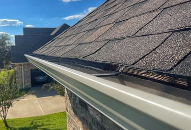 Brand new gutters installed following a full roof replacement for customer in Bullard, TX