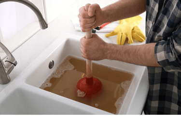 Plumber Unclogging and cleaning drain 