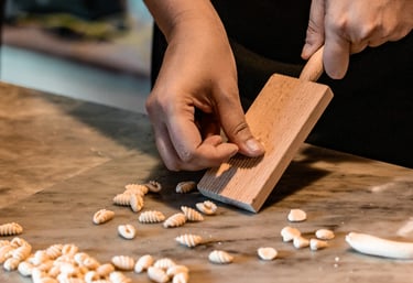 Making Sardinian malloreddus pasta during a cooking class in Sardinia.
