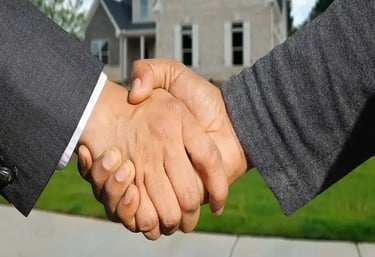 Buisness partners shaking hands for a real estate joint venture project