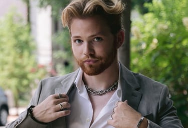 a man in a suit jacket and a white shirt