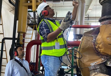 SREDA-certified energy auditor conducting flue gas analysis of a generator to measure efficiency.