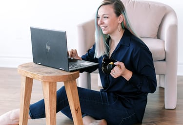 Tabitha with butterfly effect consulting on her laptop talking to a client