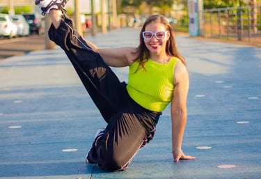 a woman in a neon green top and black pants