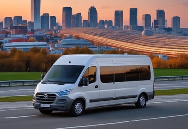 a silver airplane with a large jet flying over a building