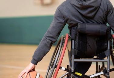Child with muscular dystrophy receiving physiotherapy for strength and mobility.