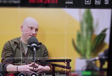 Shot of podcast guest through video monitor