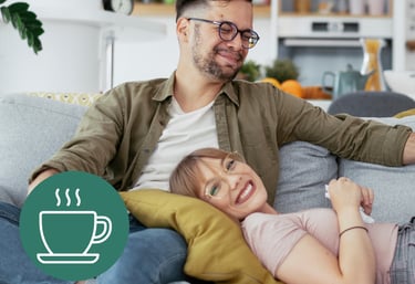 a man and woman sitting on a couch