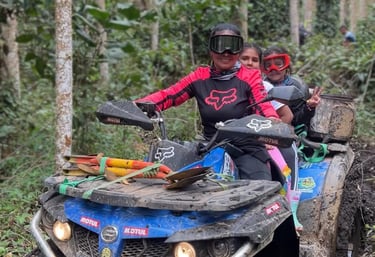 a man and a woman riding on a four wheeler atv