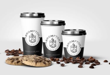 three coffee cups with coffee beans and coffee beans