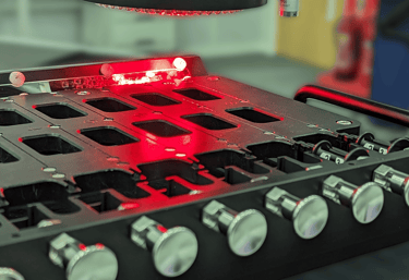 Multi-nest metrology fixture holding small thin medical devices whilst being inspected by an optical CMM.