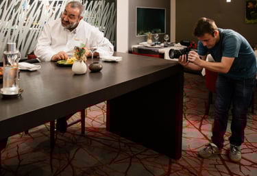 a man and woman are sitting at a table