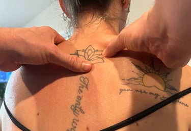 Dr Mitch working on relaxing and loosening upper back muscles