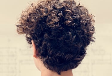 Beautiful curly hair after perm treatment - Women's perm at Just Teasin Brookfield