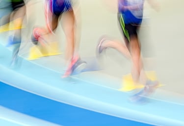 A group of people running on a track
