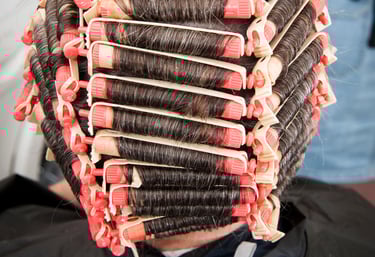 Stylist applying perm solution - Ladies permanent wave services Brookfield Illinois
