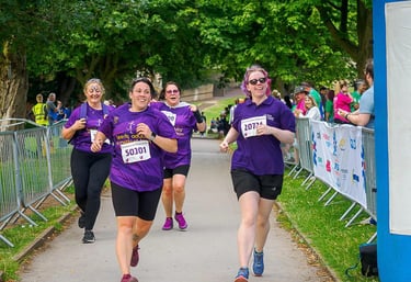 Team members running at the donor run