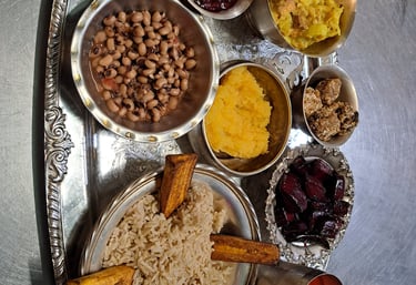 Hare Krishna Prasadam offering tray with vegetarian food in each section
