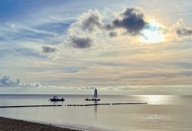 a boat near the beach in the sunset - symbolizing direction and transformation