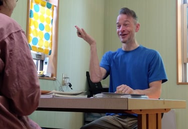 a man and woman sitting at a table