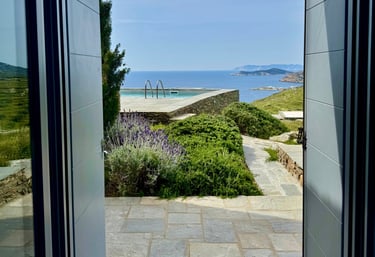 View out of one of the bedrooms over the pool onto the sea