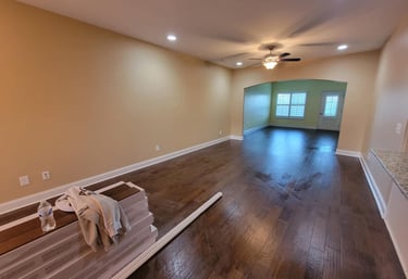 a room with a painting a flooring