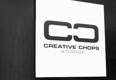 Creative Chops Studios logo on a dark wooden office door