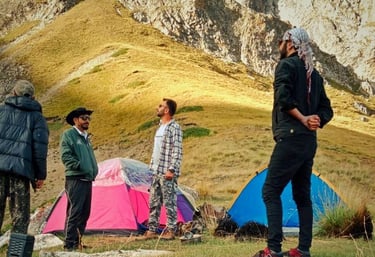 Tents set up on Khyber Sar Mountain with panoramic views of the Hunza Valley camping