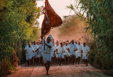 Barefoot runners in white during Corsa degli Scalzi religious tradition, Cabras, Sardinia.
