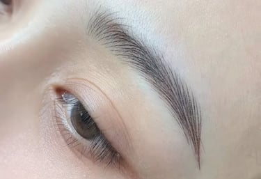 Close-up of perfectly healed nano brows with crisp, realistic hair strokes.
