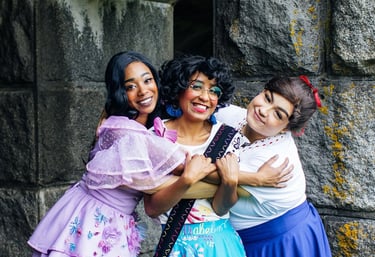 Mirabel, Isabela, and Luisa share a family hug
