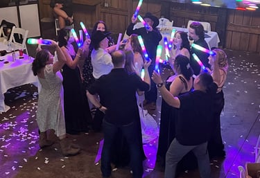 people dancing with lighted foam toys