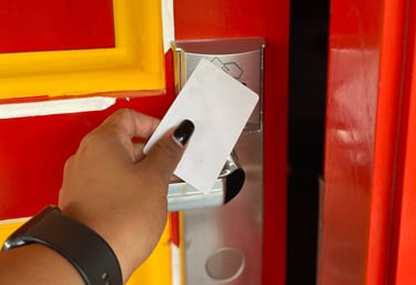 a person holding a card and a card in their hand