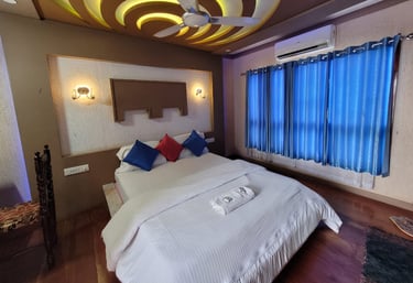 a bed room with a bed and a ceiling fan