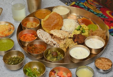 Thakorji Rajbhog Thaal, an authentic Gujarati thali in a Pune restaurant with vegetarian dishes and 