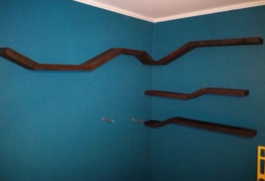 Four floating shelves mounted on wall