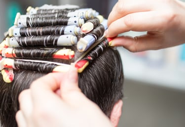 Stylist creating men's curly perm - Men's hair perm at Just Teasin Brookfield