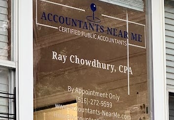 a business sign on a window of a businessr