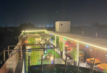 a rooftop bar with a view of a rooftop